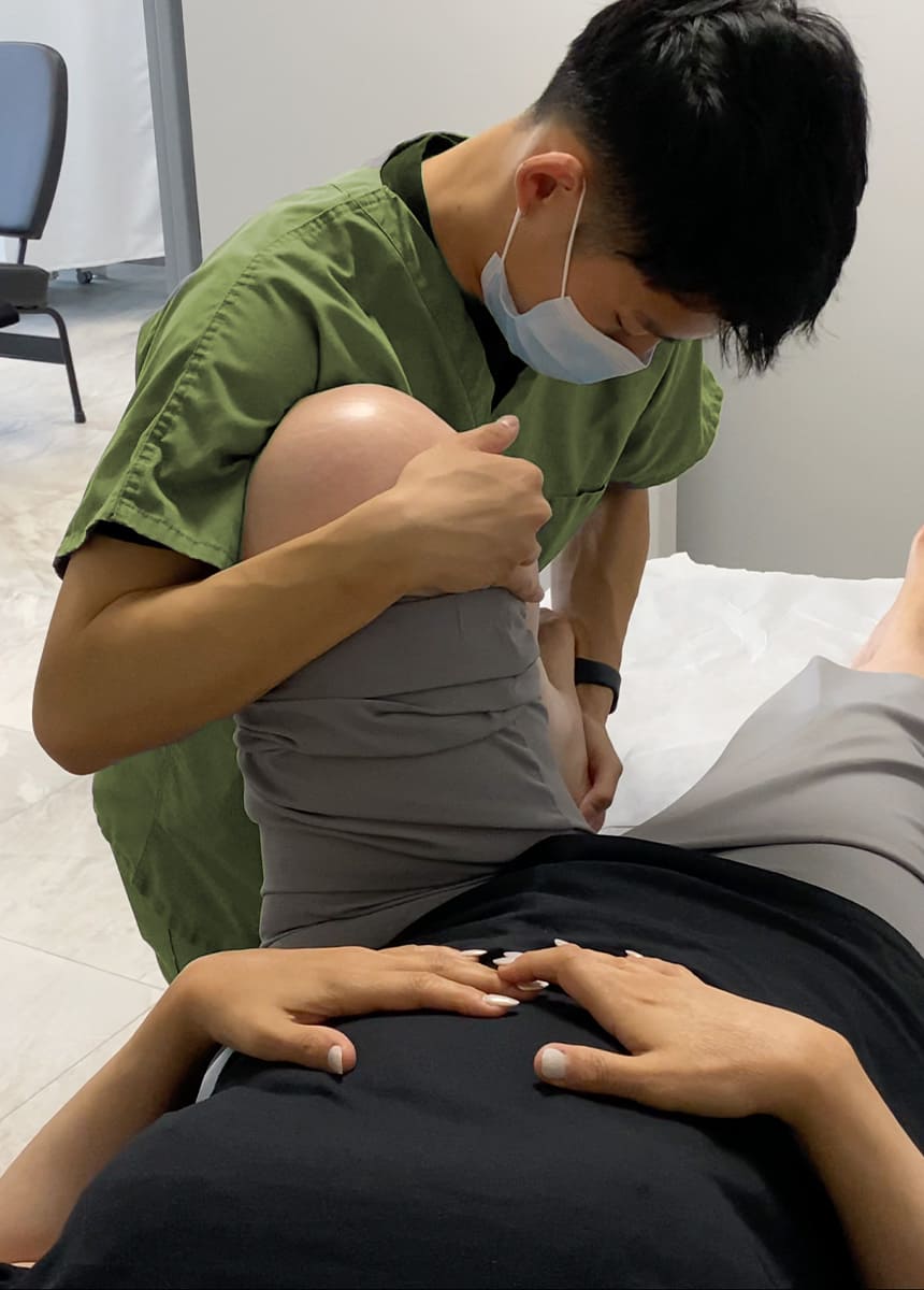 James Ma gives Physiotherapy treatment to the patient